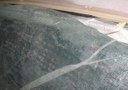 Foam after vacuum and curing with excess glue visible through scrim
