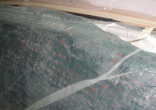 Foam after vacuum and curing with excess glue visible through scrim