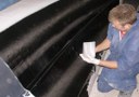Removing bubbles and wetting out carbon cloth