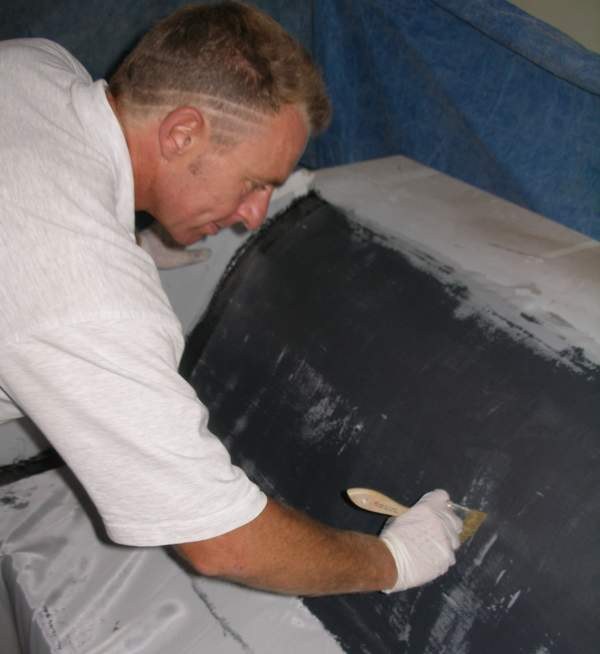 Sean removing bubbles and ensuring cloth is wetted
